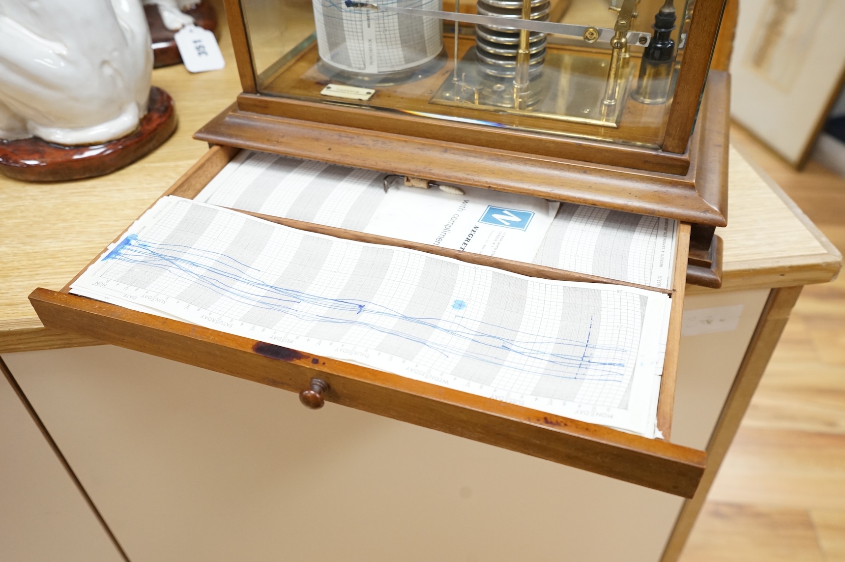 An early 20th century oak cased barograph by Finnigans Ltd., Manchester & Liverpool, with integral drawer underneath containing spare papers